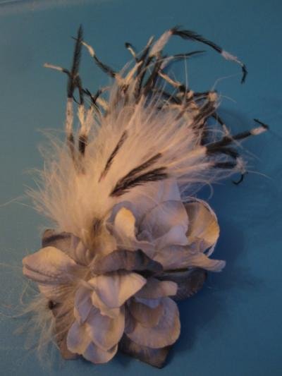 Pale blue flowers and black and white ostrich feathers